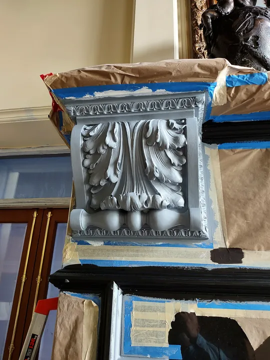 Carved acanthus corbel in gray primer